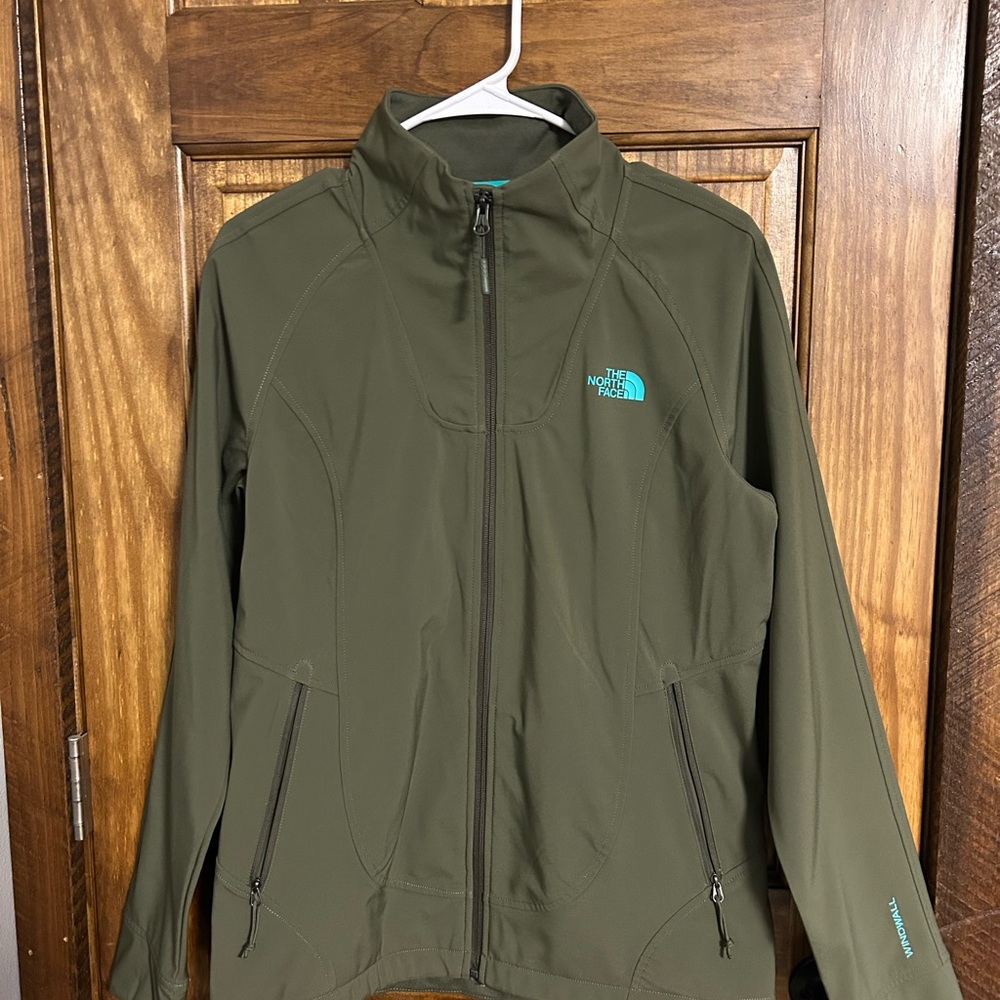 The North Face Women’s lightweight wind resistance Olive Green Jacket.
